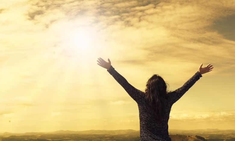 woman, sky, nature, sunlight, arms, open arms, sunbeams, sunrays, clouds, worship, freedom, happiness, relieved, prayer, praise, success, joy