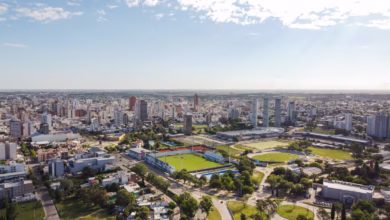 an aerial view of a city with a soccer field