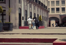 a group of people walking on a sidewalk