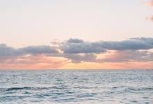 A peaceful sunset over the calming ocean.