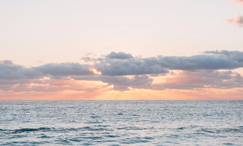 A peaceful sunset over the calming ocean.