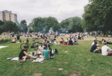 group of people gathering on field