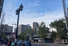 a city street with cars and people