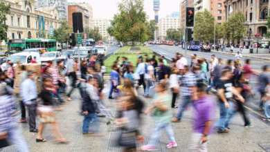 timelapse photo of people passing the street