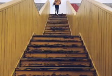 woman walking on staircase