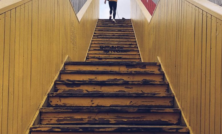 woman walking on staircase