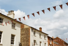 Buildings decorated with uk flag bunting.