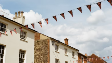 Buildings decorated with uk flag bunting.