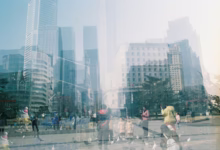Cityscape of buildings and people, a double exposure.