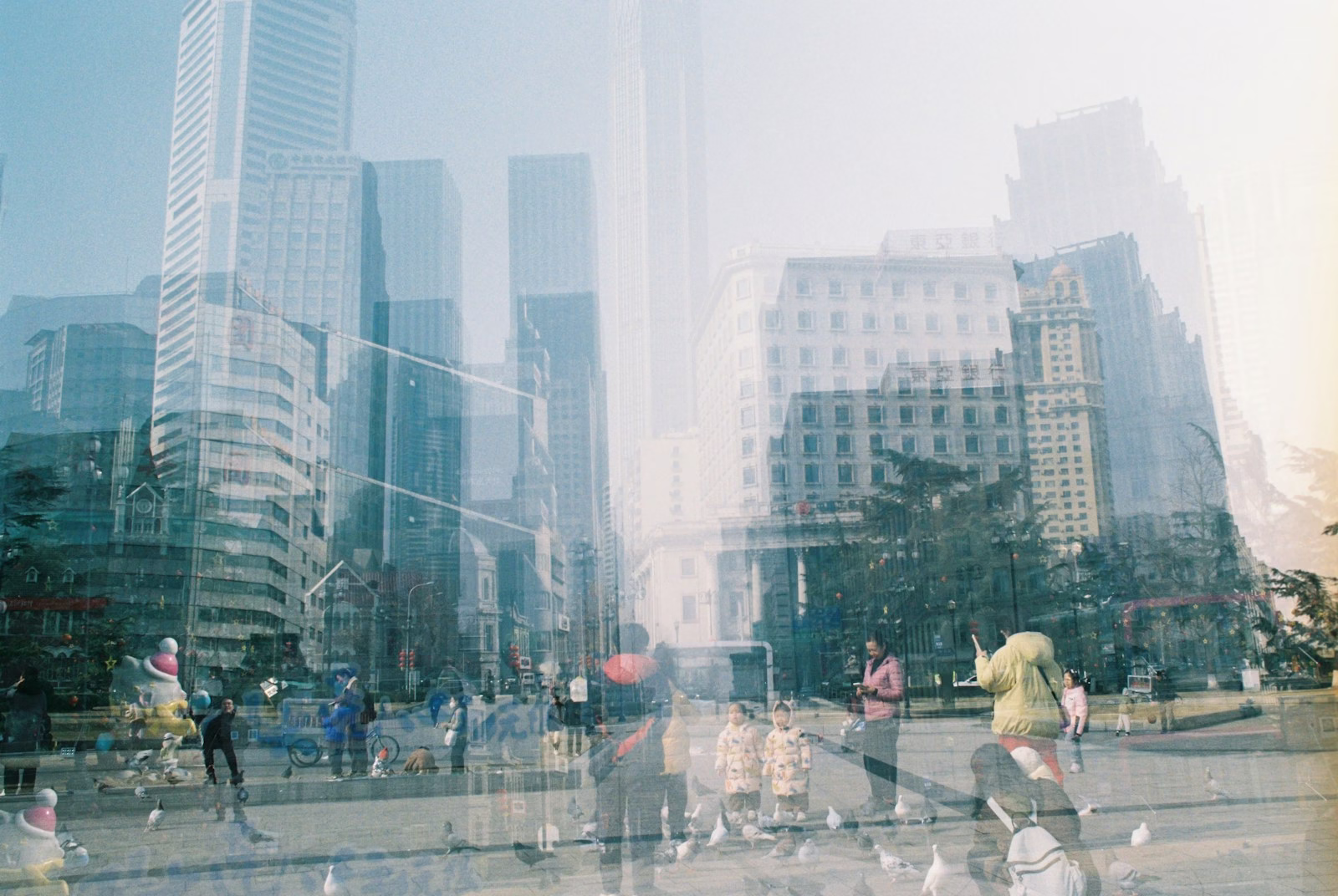 Cityscape of buildings and people, a double exposure.