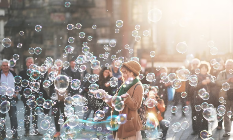 woman standing outdoor surrounded by bobbles during daytime
