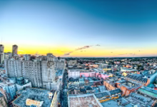 aerial photography of city buildings during yellow sunset