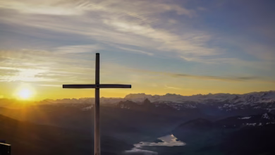 brown cross on mountain