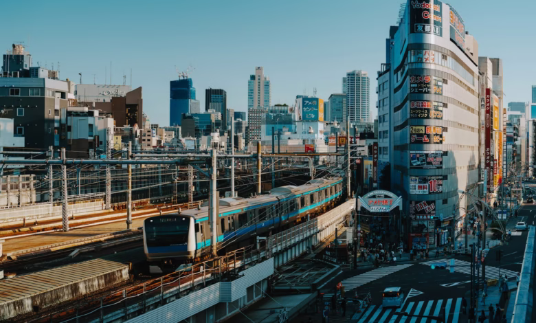 A train travels through a bustling city.