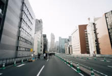 City street with modern buildings and people walking