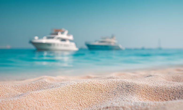 sand, beach, boats, sea, ocean, water, summer, vacation, travel, coast, shore, landscape, horizon, sky, blue, clear, sunny, tourism, nature, yacht, vessel, recreation, relaxation, destination, ai generated