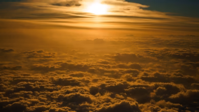 the sun is shining through the clouds in the sky