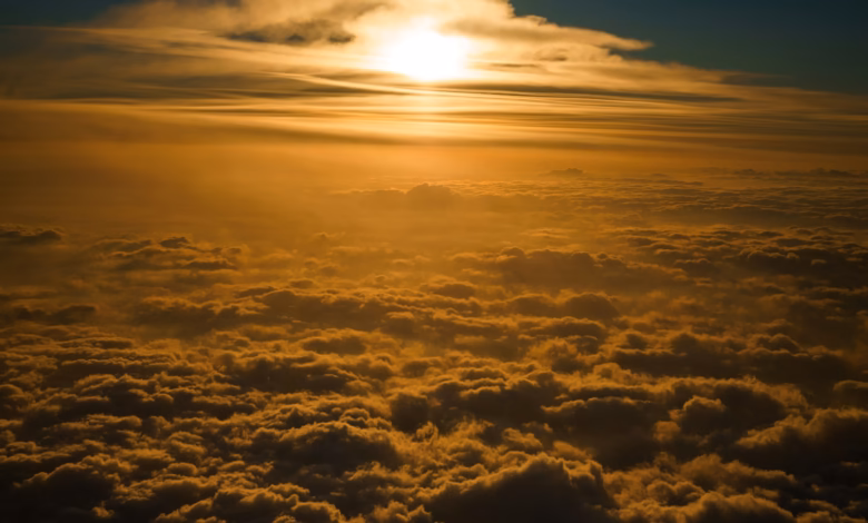 the sun is shining through the clouds in the sky