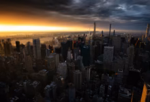 Dramatic sunset over a dense cityscape with tall buildings