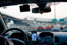 man driving vehicle with GPS system turned on