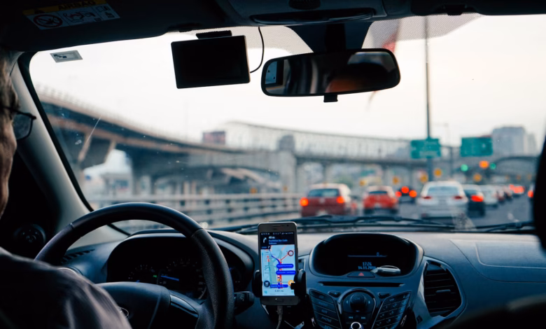 man driving vehicle with GPS system turned on