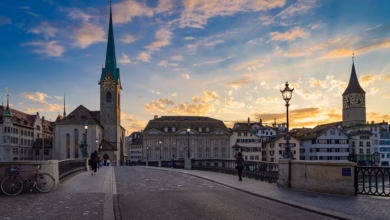 zurich, city, switzerland, architecture, building, historic center, summer, houses, heaven, churches, to travel, fraumünster, münsterbrücke, nature, dusk, magic hour, shining, backlighting, dreamy, pedestrian, church clock, monument, street lamps