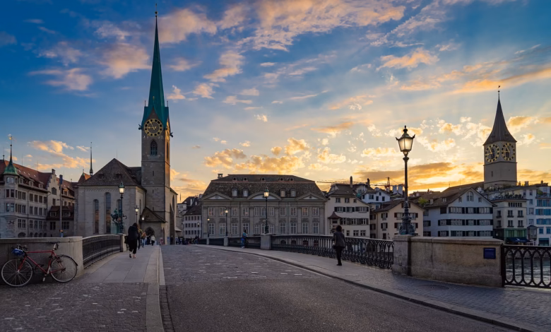 zurich, city, switzerland, architecture, building, historic center, summer, houses, heaven, churches, to travel, fraumünster, münsterbrücke, nature, dusk, magic hour, shining, backlighting, dreamy, pedestrian, church clock, monument, street lamps