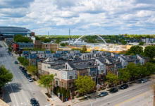 cars parked on roadside near buildings during daytime
