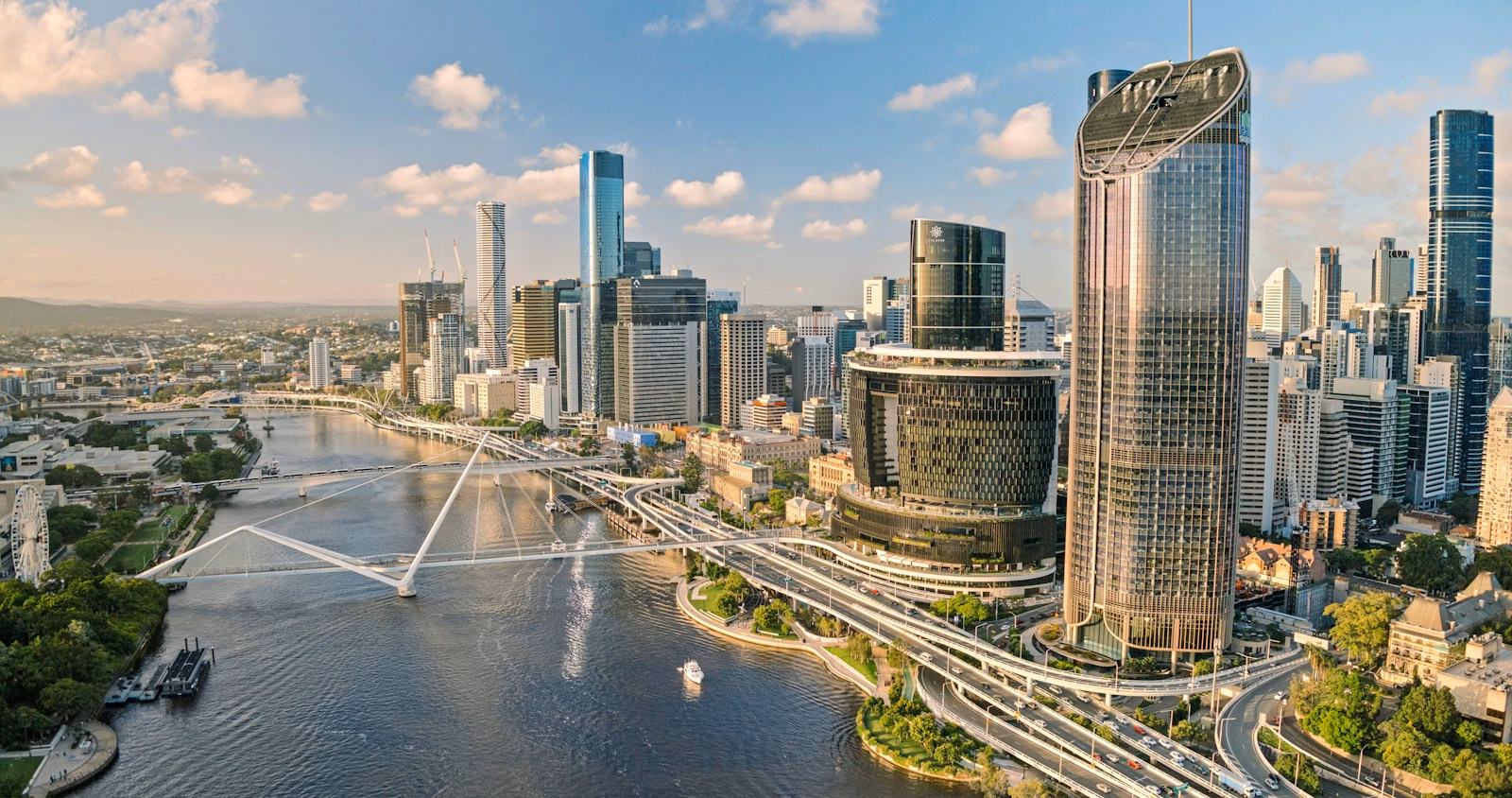 Aerial view of the Brisbane skyline and the Brisbane River at golden hour