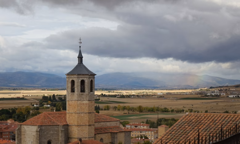 A view of a city with a rainbow in the sky