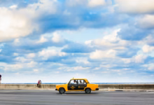 yellow and black car on beach during daytime