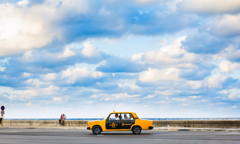yellow and black car on beach during daytime