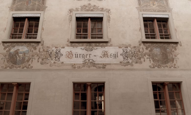 a building with windows and a sign on the side of it