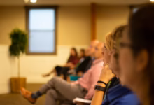 a group of people sitting in a room